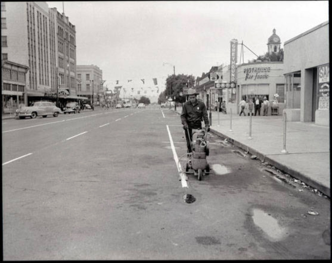 Painting parking spaces on Broadway Avenue